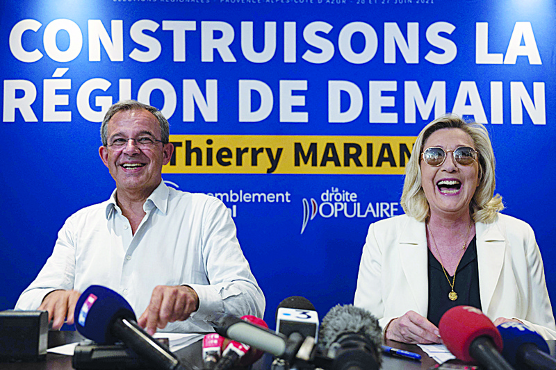 TOULON: French far-right Rassemblement National (RN) party's leader and member of parliament Marine Le Pen (R) shares a laugh with RN top candidate in Provence-Alpes-Cote d'Azur (PACA) for the upcoming regional elections Thierry Mariani (L) during a press conference in Toulon. - AFPnn