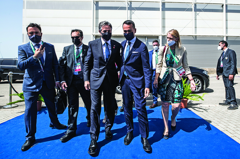 ROME: Italian Minister of Foreign Affairs Luigi Di Maio (right) welcomes US Secretary of State Antony Blinken (left) upon his arrival for a meeting of the US-led coalition against the Islamic State (IS) group, at the Fiera di Roma, in Rome, as part of Blinken's three-nation tour of Europe yesterday.-AFPnn