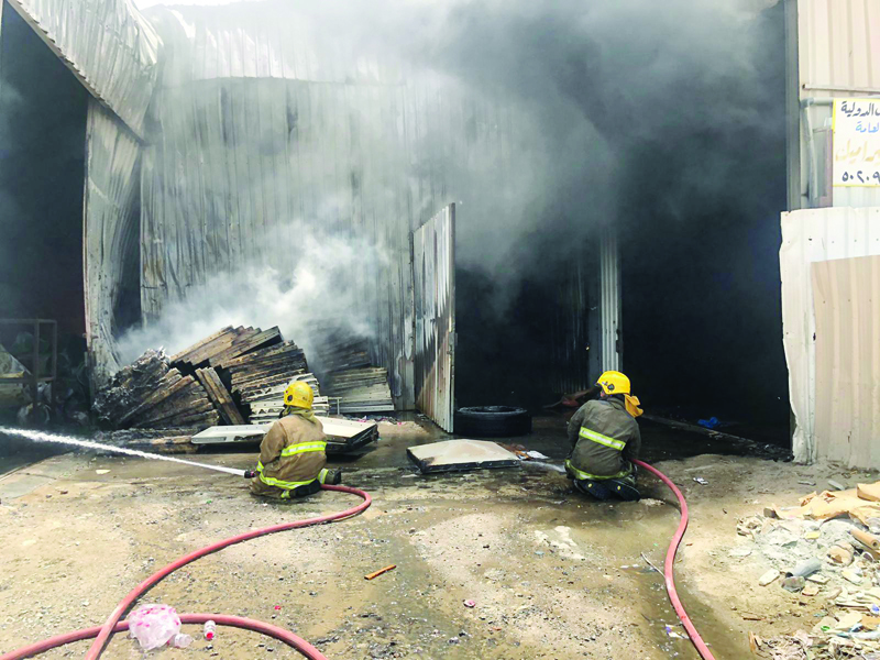 KUWAIT: Firemen battle the blaze in Amghara yesterday.n