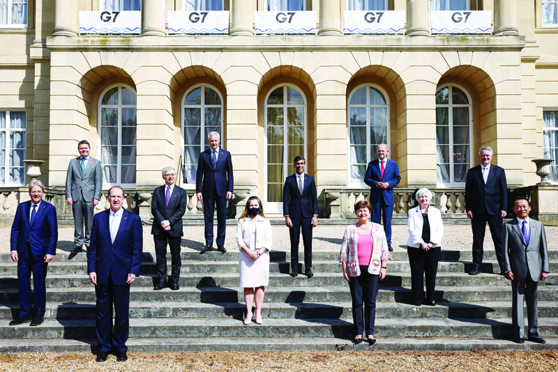 LONDON: Top officials pose for a family photo on the second day of the G7 finance ministers' meeting at Lancaster House yesterday. - AFP n