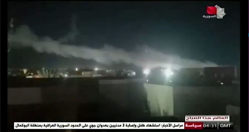 In this image grab taken from a broadcast by Syria TV yesterday shows smoke billowing from a facility used by Iran-backed groups following US air strikes on the Syrian-Iraqi border. - AFPn