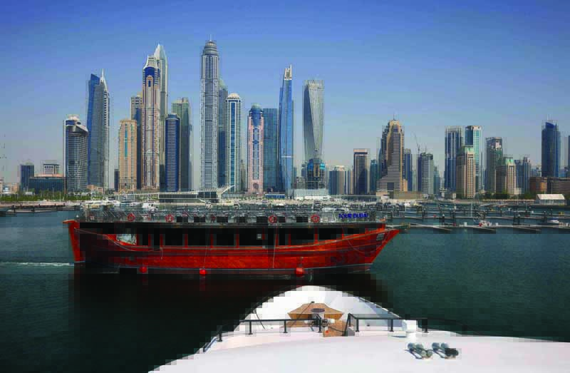 DUBAI: A restaurant cruiser sails by the Dubai Marina Beach on June 9, 2021. - AFP n