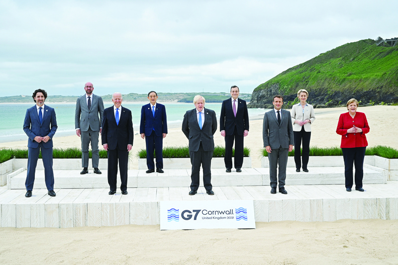 CARBIS BAY: (From left) Canada's Prime Minister Justin Trudeau, President of the European Council Charles Michel, US President Joe Biden, Japan's Prime Minister Yoshihide Suga, Britain's Prime Minister Boris Johnson, Italy's Prime minister Mario Draghi, France's President Emmanuel Macron, President of the European Commission Ursula von der Leyen and Germany's Chancellor Angela Merkel pose for a family photo at the start of the G7 summit on Friday. - AFP n