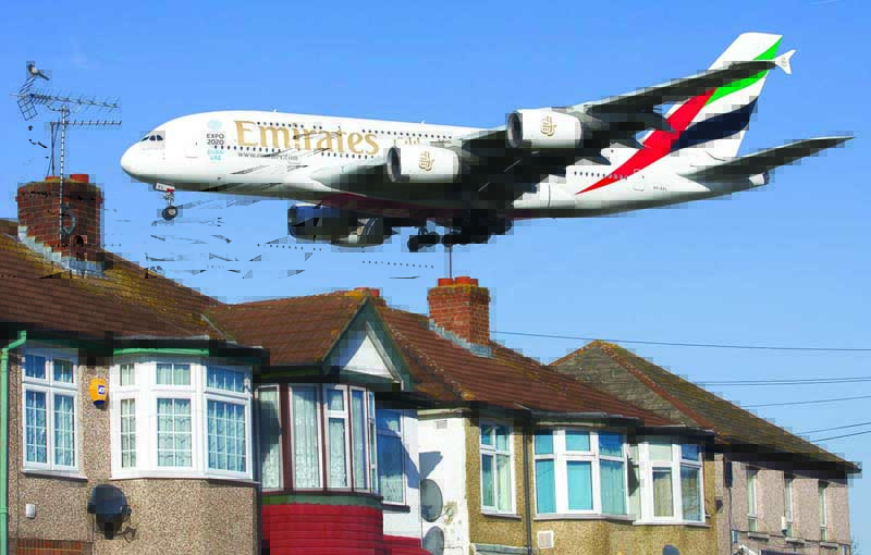 LONDON: In this file photo taken on Feb 18, 2015, an Emirates Airbus A380 aircraft is seen above rooftops as it lands at Heathrow Airport. - AFP n