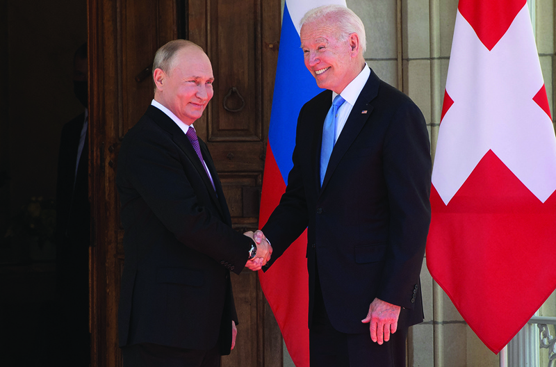 GENEVA: US President Joe Biden and Russian President Vladimir Putin shake hands as they arrive at Villa La Grange for the start of their summit yesterday. - AFP n