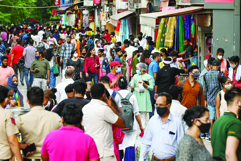 NEW DELHI: People throng Sarojini Nagar market for shopping after authorities eased a lockdown on Saturday. - AFP n
