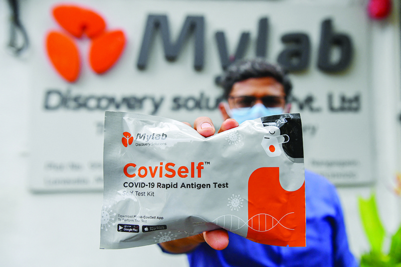 LONAVLA, India: Dr Shrikant Pawar, Head - Serology and Microbiome, displays a pack of Coviself at the Mylab Discovery Solutions manufacturing facility on June 10, 2021. - AFP n