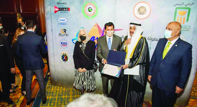 CAIRO: Egyptian Minister of Youth and Sports honors President of Kuwait and Arab Shooting Federations Duaij Al-Otaibi. - KUNA nn