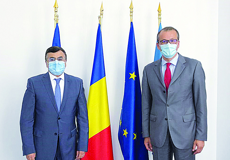 BUCHAREST: Kuwait's Ambassador to Romania Talal Al-Hajri (left) with Romanian State Secretary for Global Affairs and Diplomatic Strategies Cornel Feruta. - KUNAn