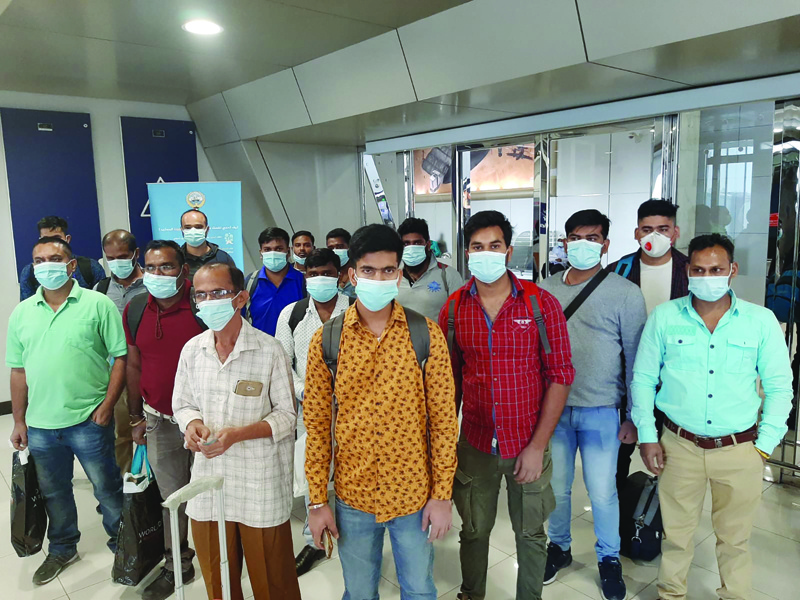 KUWAIT: Sixteen Indian sailors who were stranded in Kuwait for the past 14 months are seen at Kuwait International Airport prior to their departure to India on Friday. n