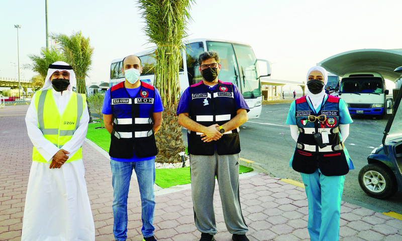 KUWAIT: Jaber Causeway Vaccination Center's General Supervisor Dr Talal Al-Fadhalah (second left) with Zain Kuwait's External and Internal Relations Department Manager Hamad Al-Matar (left), the center's Technical Supervisor Dr Hamad Al-Ansari (second right), and the center's Administrative Supervisor Dr Dalal Al-Ajmi.n