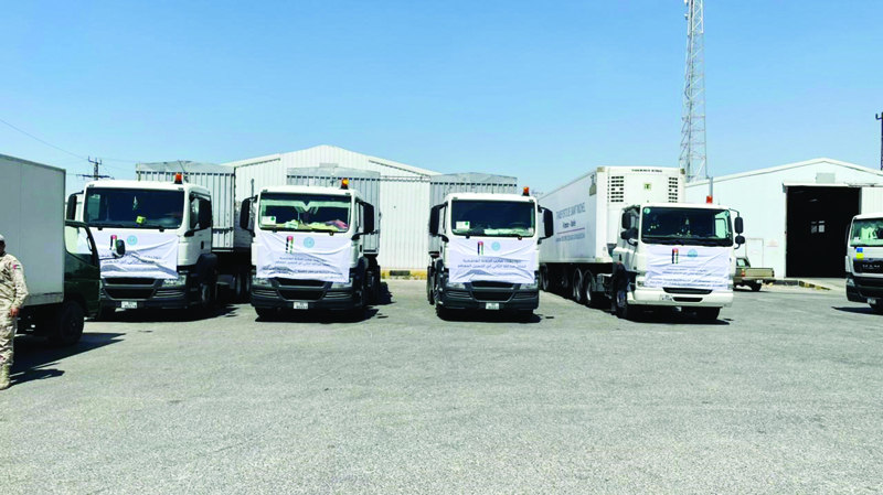 AMMAN: Trucks carrying Kuwaiti aid prepare to leave to the Gaza strip. - KUNAnnnnn