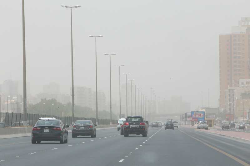 Cars seen moving slowly yesterday due to unstable weather. - Photo by Yasser Al Zayat