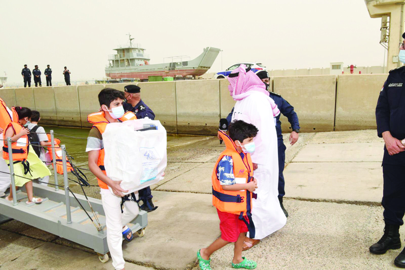KUWAIT: Minister of Interior Sheikh Thamer Ali Sabah Al-Salem Al-Sabah supervises the evacuation process. - KUNAn