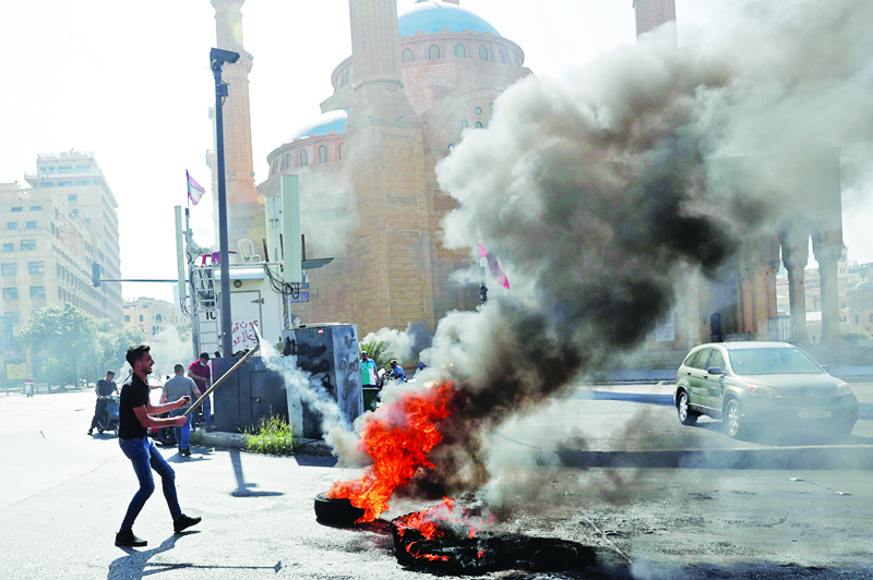 BEIRUT: Demonstrators burn tires to block the Martyrs' Square in the center of Lebanon's capital Beirut as they protest against dire living conditions amidst the ongoing economic and political crisis. - AFPn