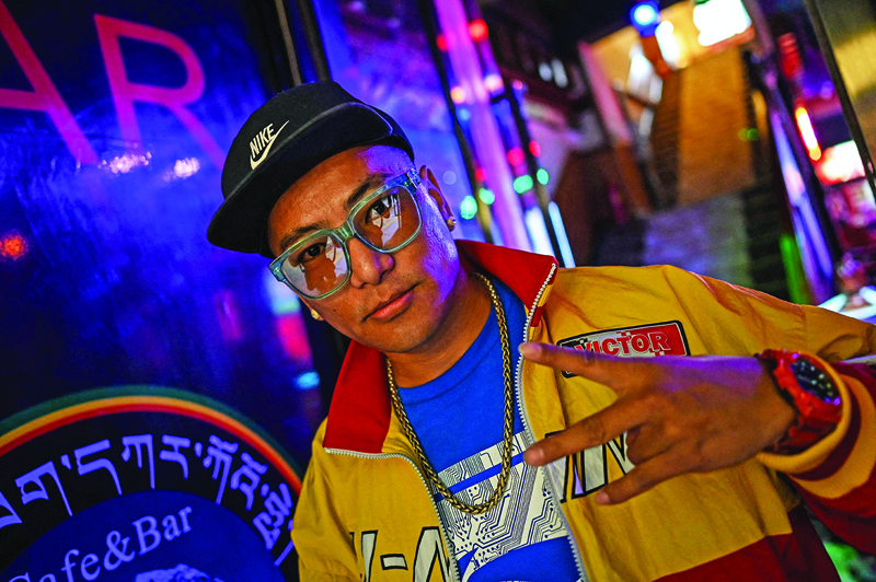 In this photograph taken on June 1, 2021, Tibetan rapper Tenzin Dhondup, MC Tenzin, poses for a picture in a bar in the regional capital Lhasa, in China's Tibet Autonomous Region. – AFP n