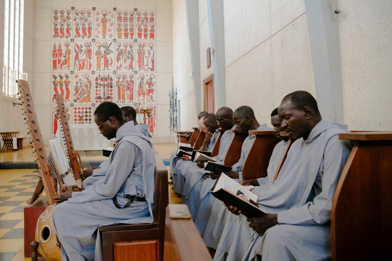 The monks read during the mass inside the church of the Abbey of Keur Moussa, in Senegal.  — AFP photosn