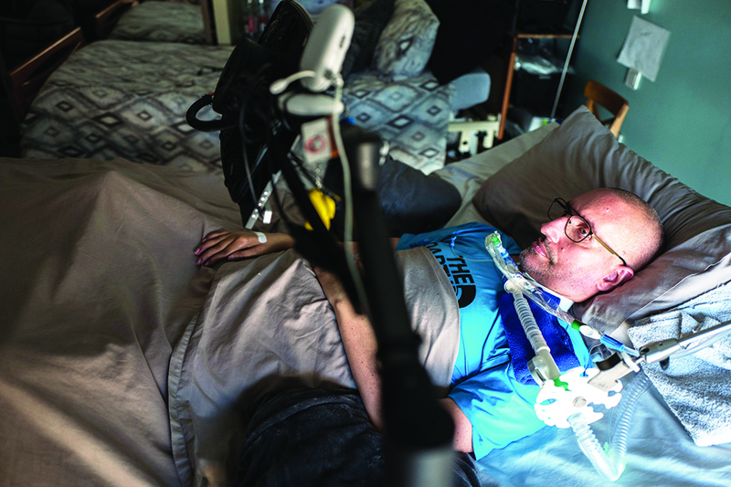 Guilhem Gallart, known as Pone, lies on a bed at his home in Gaillac in the south of France on June 16, 2021. – AFP n