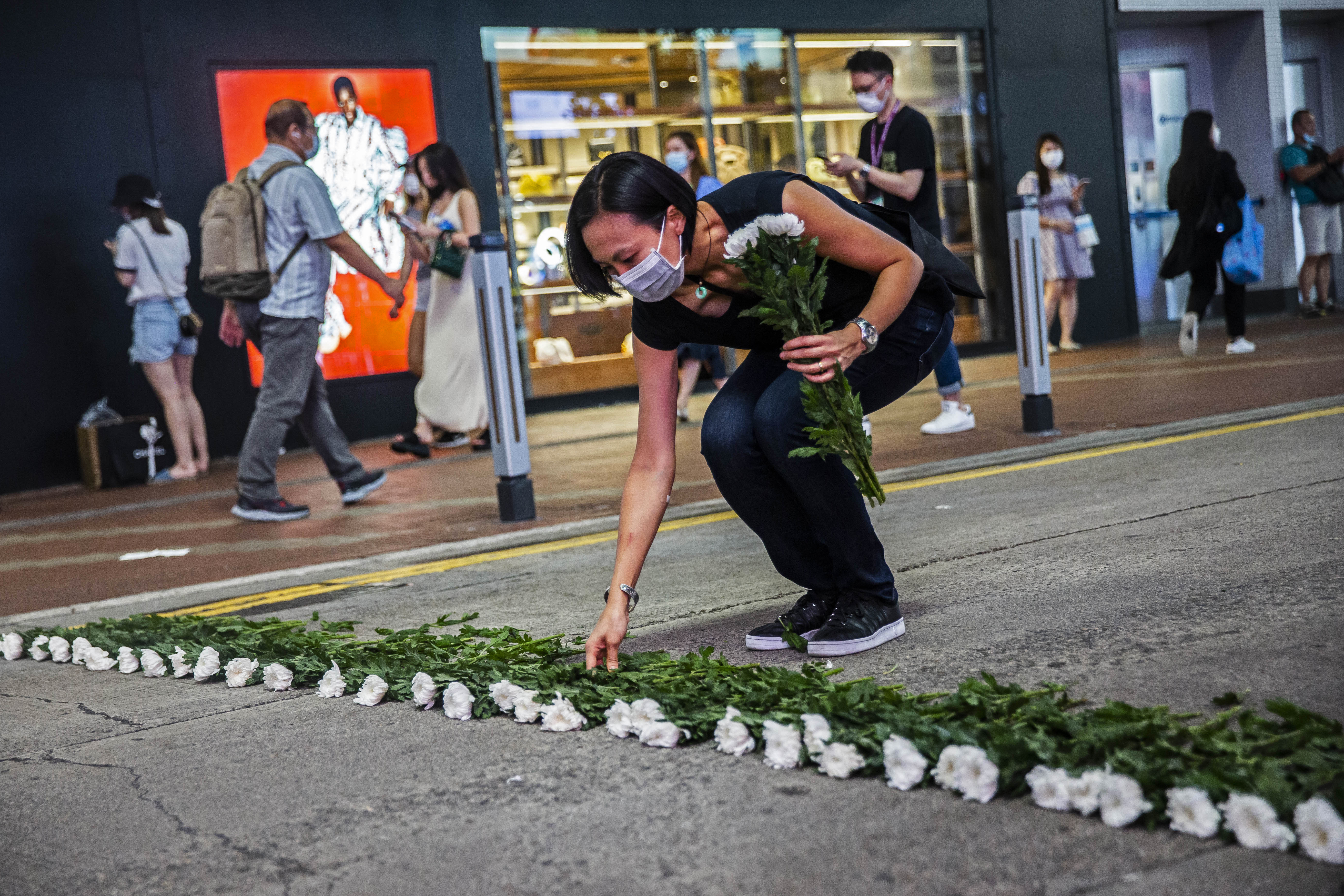 HONG KONG: An artist takes part in a performance art in the Causeway Bay district yesterday to mourn the victims of China's deadly Tiananmen Square crackdown after authorities banned an annual vigil and vowed to stamp out any protests come the anniversary on June 4. - AFP n