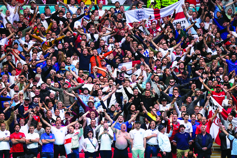 LONDON: England fans cheer before the UEFA EURO 2020 round of 16 football match between England and Germany at Wembley Stadium in London on Tuesday. - AFPn
