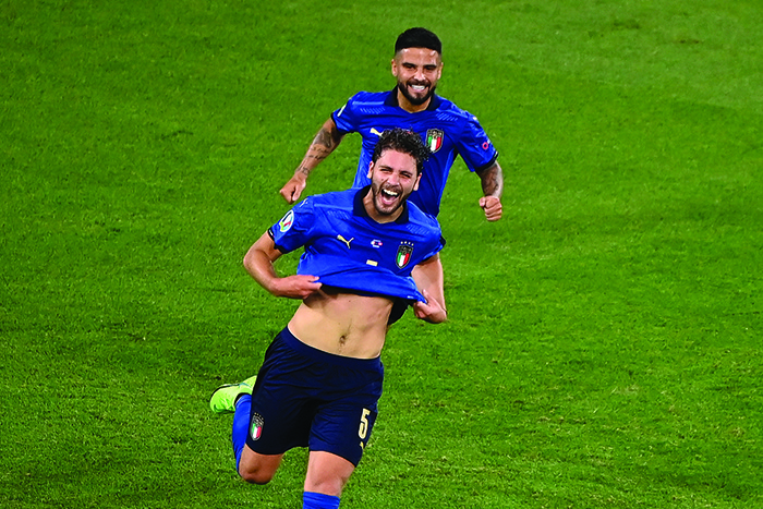 ROME: Manuel Locatelli (front) celebrates with Lorenzo Insigne after he scored Italy’s first goal during the UEFA EURO 2020 Group A match vs Switzerland at the Olympic Stadium in Rome on June 16, 2021. — AFP