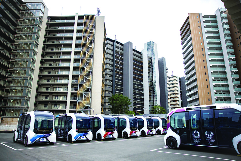TOKYO: Autonomous electric vehicles, which will be used at the Olympic Village, are seen during a media tour of the Tokyo 2020 Olympic and Paralympic Village in Tokyo yesterday. - AFPn