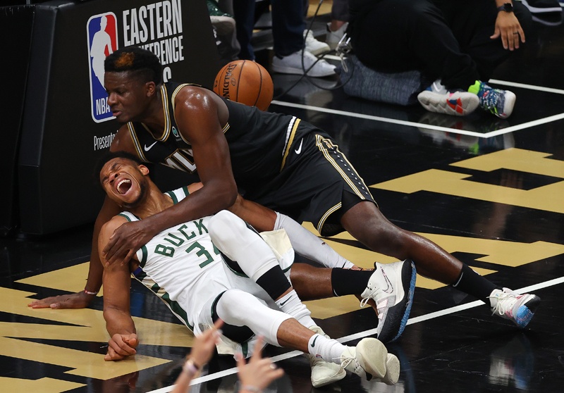 ATLANTA: Giannis Antetokounmpo #34 of the Milwaukee Bucks is injured against Clint Capela #15 of the Atlanta Hawks during the second half in Game Four of the Eastern Conference Finals at State Farm Arena on Tuesday in Atlanta, Georgia. – AFPn