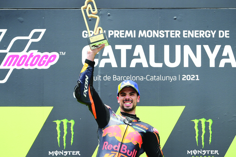 MONTMELO: KTM Portuguese rider Miguel Oliveira celebrates on the podium after winning the MotoGP race of the Moto Grand Prix de Catalunya at the Circuit de Catalunya yesterday in Montmelo on the outskirts of Barcelona. - AFPnn