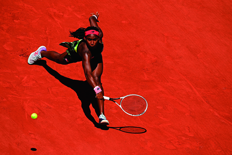 PARIS: Coco Gauff of the US returns the ball to Tunisia's Ons Jabeur during their women's singles fourth round tennis match on Day 9 of The Roland Garros 2021 French Open tennis tournament in Paris yesterday. - AFPnn