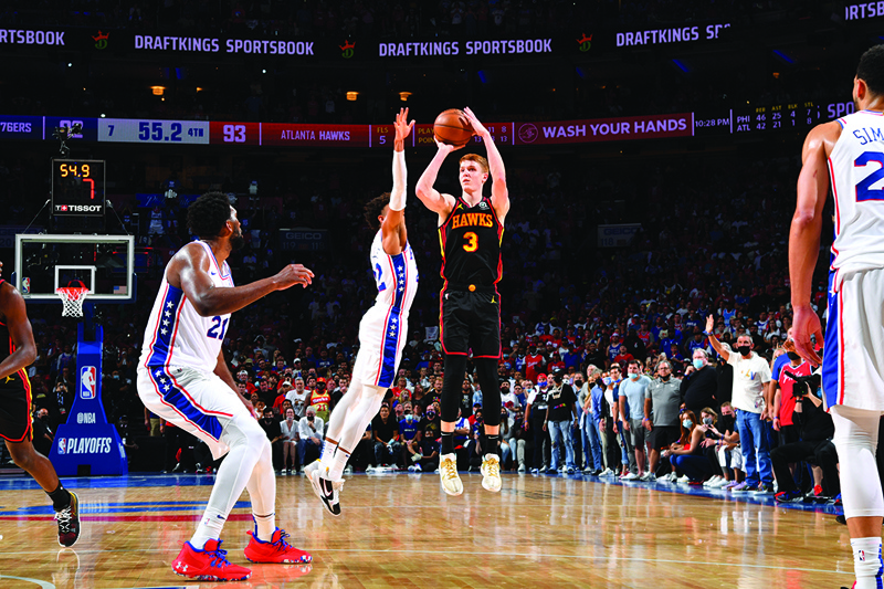 PHILADELPHIA: Kevin Huerter #3 of the Atlanta Hawks shoots a three-pointer against the Philadelphia 76ers during Round 2, Game 7 of the Eastern Conference Playoffs on Sunday at Wells Fargo Center in Philadelphia, Pennsylvania. - AFPn