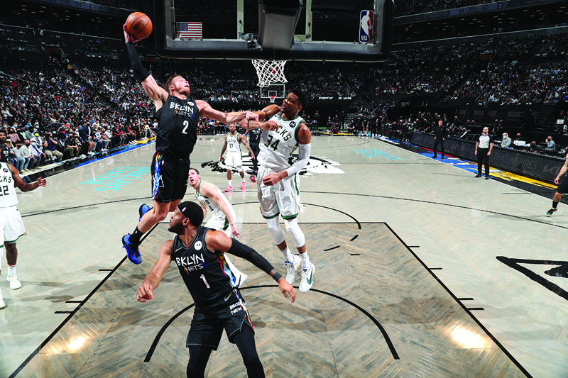 BROOKLYN: Blake Griffin #2 of the Brooklyn Nets dunks the ball against the Milwaukee Bucks during Round 2, Game 2 of the 2021 NBA Playoffs on Monday at Barclays Center in Brooklyn, New York. - AFPn