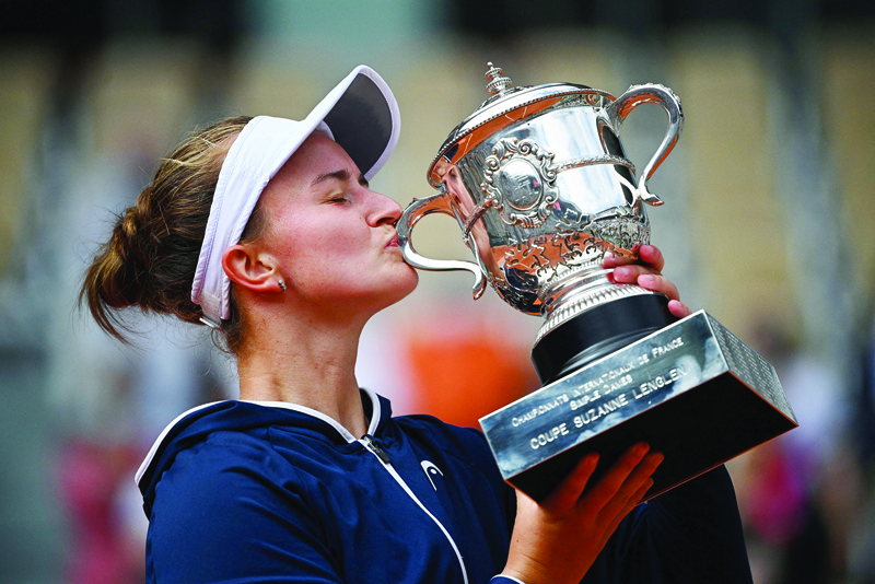 PARIS: Czech Republic's Barbora Krejcikova kisses and celebrates with the Suzanne Lenglen Cup after winning the women's singles final match against Russia's Anastasia Pavlyuchenkova during the trophy ceremony of The Roland Garros 2021 French Open tennis tournament yesterday. - AFP n