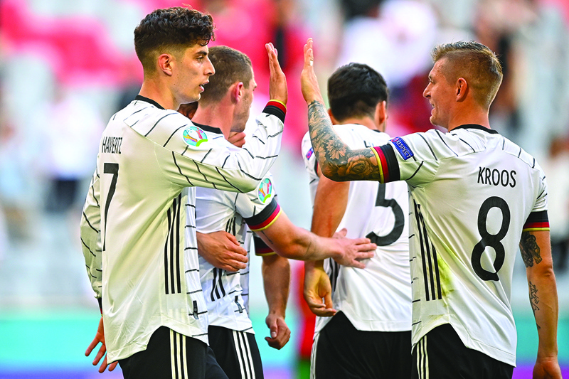 MUNICH: Germany's forward Kai Havertz (left) celebrates with Germany's midfielder Toni Kroos after scoring his team's third goal during the UEFA EURO 2020 Group F football match between Portugal and Germany at Allianz Arena in Munich, Germany, on Saturday. - AFPnn