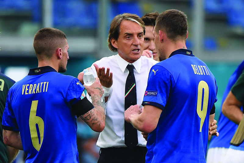 ROME: Italy's coach Roberto Mancini (center) speaks with Italy's midfielder Marco Verratti (left) and Italy's forward Andrea Belotti during the UEFA EURO 2020 Group A football match between Italy and Wales at the Olympic Stadium in Rome on Sunday. - AFPn