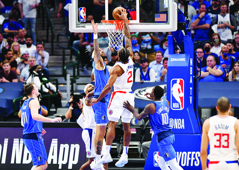 DALLAS: Kawhi Leonard #2 of the LA Clippers dunks during the game against the Dallas Mavericks during Round 1, Game 6 of the 2021 NBA Playoffs on Friday at the American Airlines Center in Dallas, Texas. - AFPn