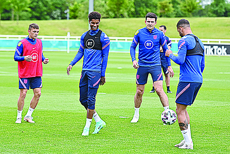 BURTON-ON-TRENT: England's defender Kieran Trippier (left), forward Marcus Rashford (second left), defender Harry Maguire (second right) and defender Kyle Walker take part in a training session at St George's Park in Burton-upon-Trent, central England, yesterday ahead of the UEFA EURO 2020 football competition. - AFPnn