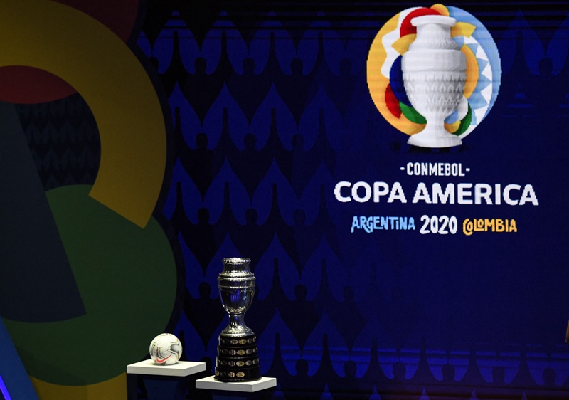 CARTAGENA: In this file photo taken on December 03, 2019, the Copa America trophy and the official ball are seen during the draw of the Copa America 2020 football tournament, at the Convention Centre in Cartagena, Colombia. – AFPnn