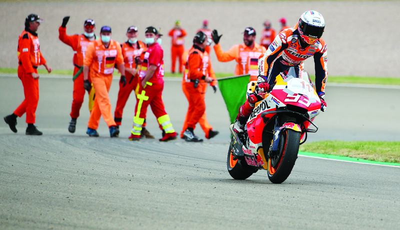 SACHSENRING: Honda Spanish rider Marc Marquez is celebrated by the circuit staff after winning the German MotoGP Grand Prix at the Sachsenring racing circuit in Hohenstein-Ernstthal near Chemnitz, eastern Germany, yesterday. - AFPnn