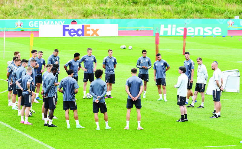 HERZOGENAURACH: Germany's coach Joachim Loew speaks to his players during an MD-1 training session at the team's base at the Adi Dassler stadium in Herzogenaurach, Germany, yesterday, on the eve of their UEFA EURO 2020 Group F football match against Hungary.  - AFPn