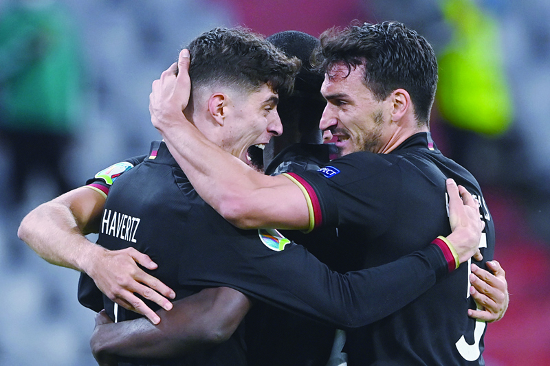 MUNICH: Germany's forward Kai Havertz (left) celebrates with Germany's defender Mats Hummels (right) after scoring their first goal during the UEFA EURO 2020 Group F football match between Germany and Hungary at the Allianz Arena in Munich on Wednesday. - AFPn