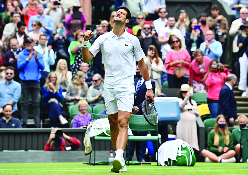 LONDON: Serbia's Novak Djokovic celebrates his victory over South Africa's Kevin Anderson during their men's singles second round match on the third day of the 2021 Wimbledon Championships at The All England Tennis Club in Wimbledon, southwest London yesterday. - AFPn