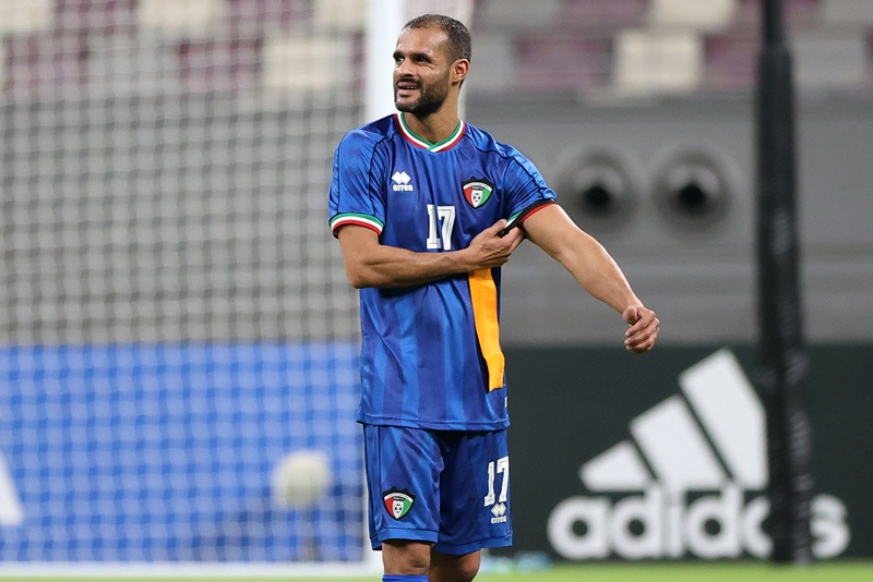 DOHA: Kuwait's forward and captain Bader al-Mutawa walks on the pitch with his captain's badge after the 2021 FIFA Arab Cup qualifier match between Bahrain and Kuwait at Khalifa International Stadium in Doha, on Friday. - AFP n