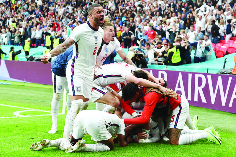 LONDON: England's players celebrate their second goal during the Euro 2020 round of 16 football match between England and Germany at Wembley Stadium in London yesterday. - AFPn