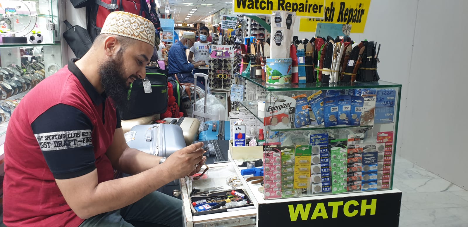 Watchmaker Ali Asgar repairs a watch at a shop in Souq Watiya in Kuwait City.n