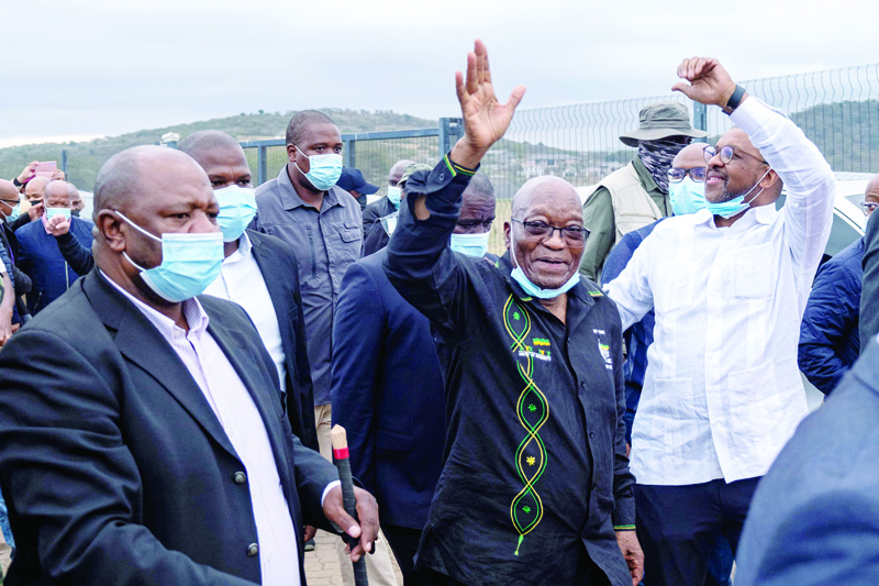NKANDLA, South Africa: Former South African president Jacob Zuma walks back to his home after addressing his supporters in front of his rural home on Sunday for the first time since he was given a 15-month sentence for contempt of court. - AFP n