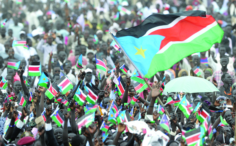 JUBA, Sudan: In this file photo Thousands of Southern Sudanese wave the flag of their new country during a ceremony in the capital Juba to celebrate South Sudan's independence from Sudan. - AFP n