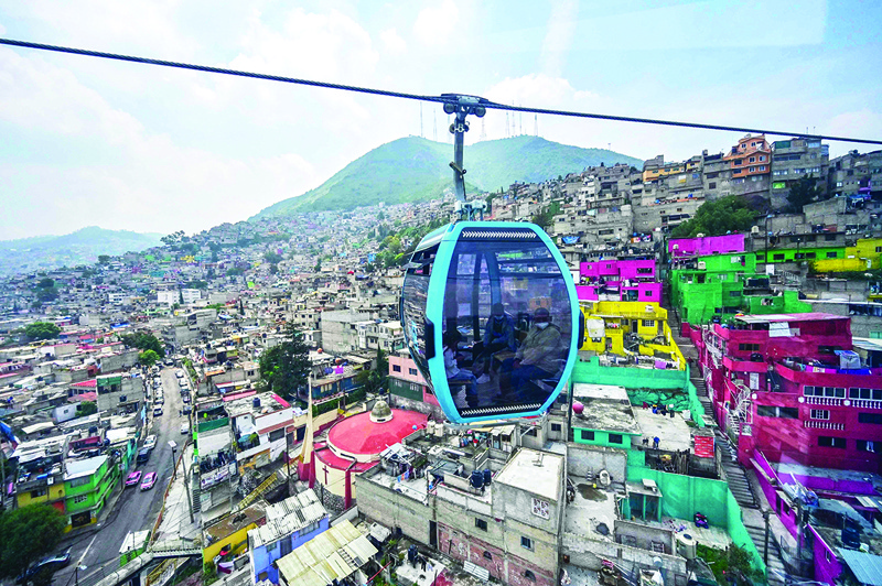 MEXICI CITY: Passengers travel on the cable car system dubbed Cablebus after its inauguration outskirts of Mexico City, on July 12, 2021. – AFPnn