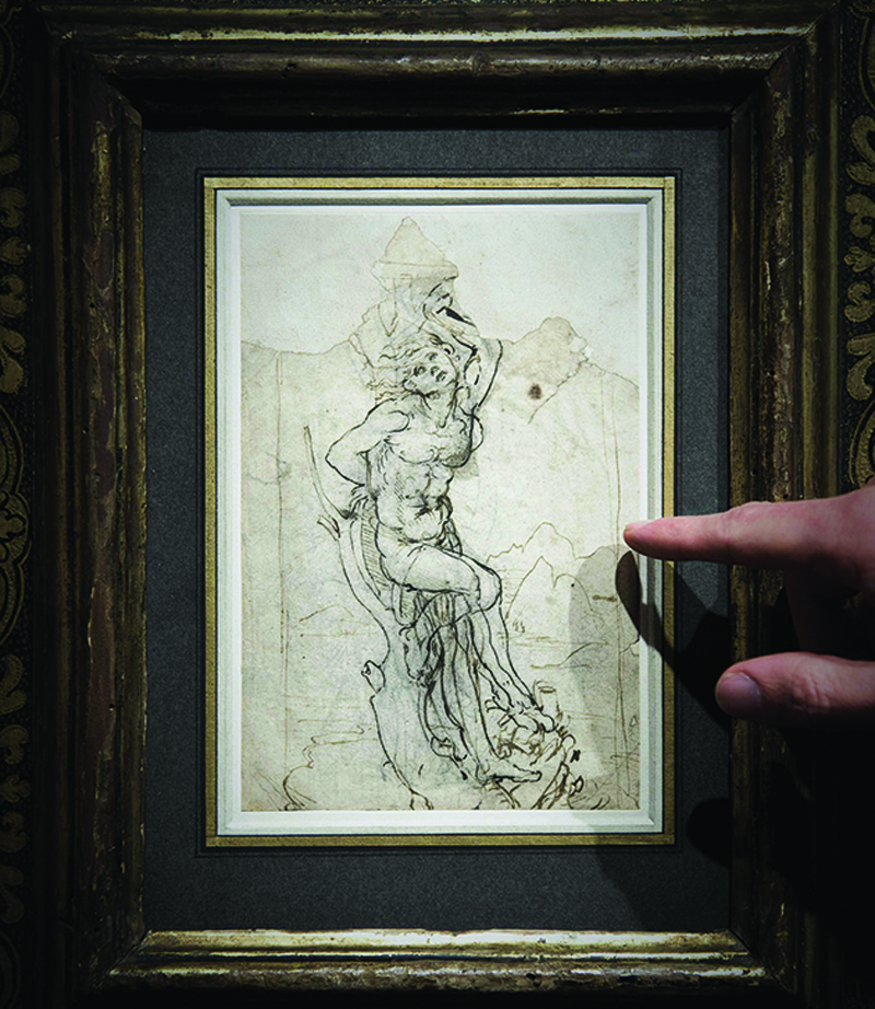 In this file photo, a member of Paris auctioneer Tajan displays a previously undiscovered drawing by Leonardo da Vinci at the auction house in Paris. — AFP n
