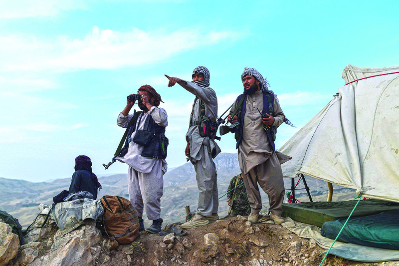 BALKH: In this picture taken on July 15, 2021, Afghan militia fighters keep a watch at an outpost against Taleban insurgents at Charkint district in Balkh Province. – AFPn
