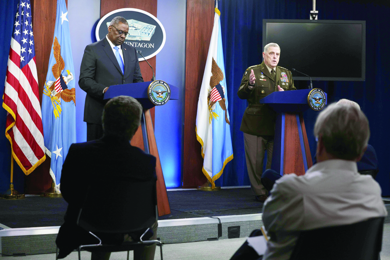 ARLINGTON: US Secretary of Defense Lloyd Austin (L) and Chairman of Joint Chiefs of Staff Gen. Mark Milley (R) participate in a news briefing at the Pentagon in Arlington, Virginia. Secretary Austin and Gen. Milley held a news briefing to discuss various topics including the US withdrawal from Afghanistan. - AFPn
